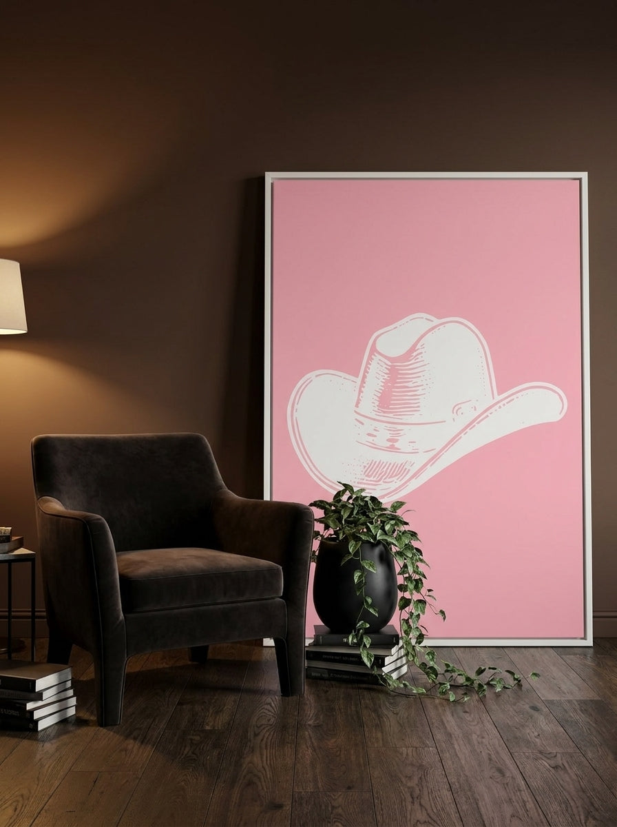 Oversized statement canvas wall art with a white surround leaning against the wall in a moody home office