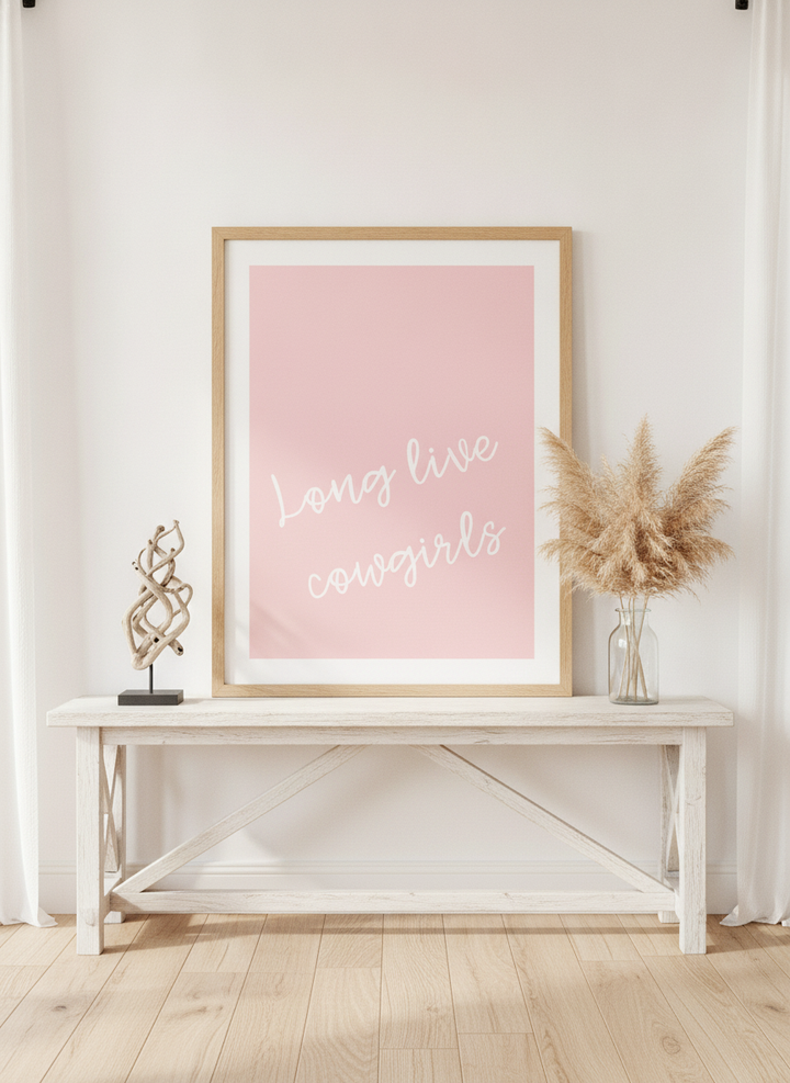 Modern wall art print standing on a console in a coastal living room
