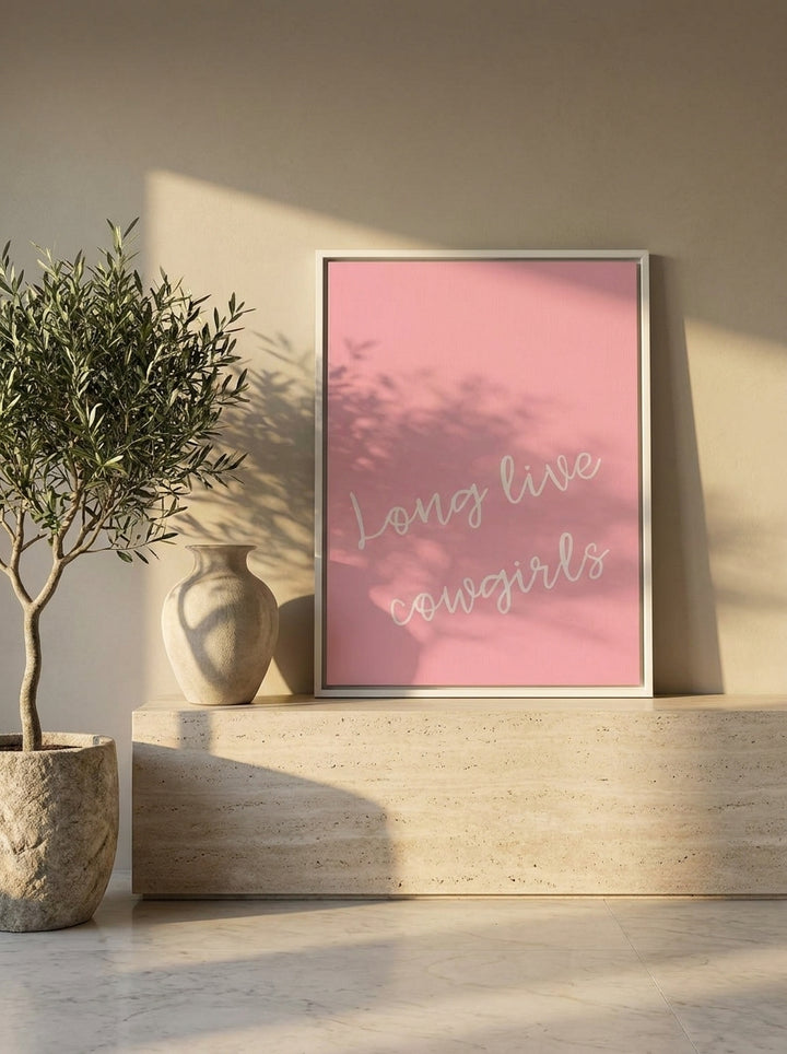 Canvas wall art with a white surround standing on a console in a luxe bedroom