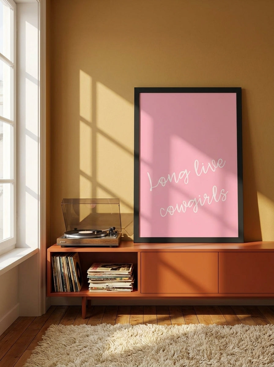 Modern wall art print standing on a sideboard in a retro 70s bedroom
