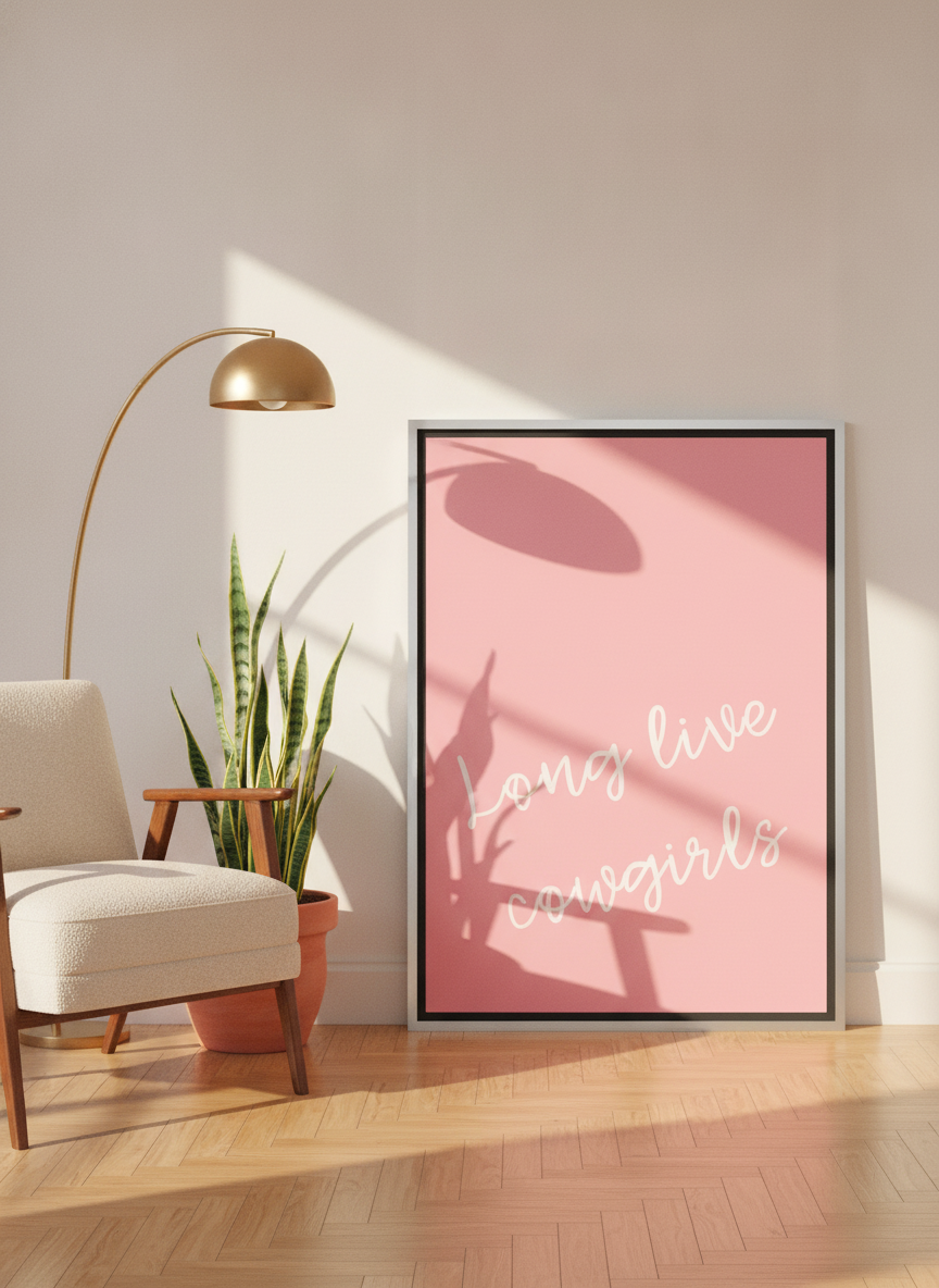 Canvas wall art with a silver leaf surround leaning against the wall in a mid-century living room