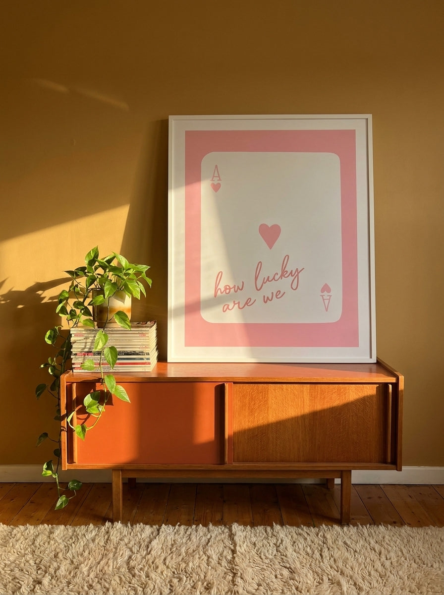 Modern wall art print standing on a sideboard in a retro 70s living room