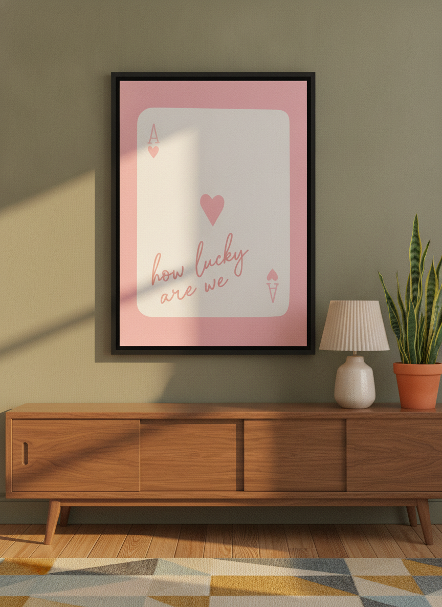 Canvas wall art with a black surround standing on a sideboard in a mid-century bedroom