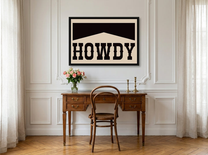 Canvas wall art with a black surround styled on the wall in a Parisian home office