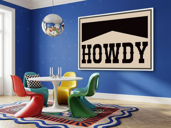 Oversized statement canvas wall art with a white surround styled on the wall in a colourful eclectic dining room