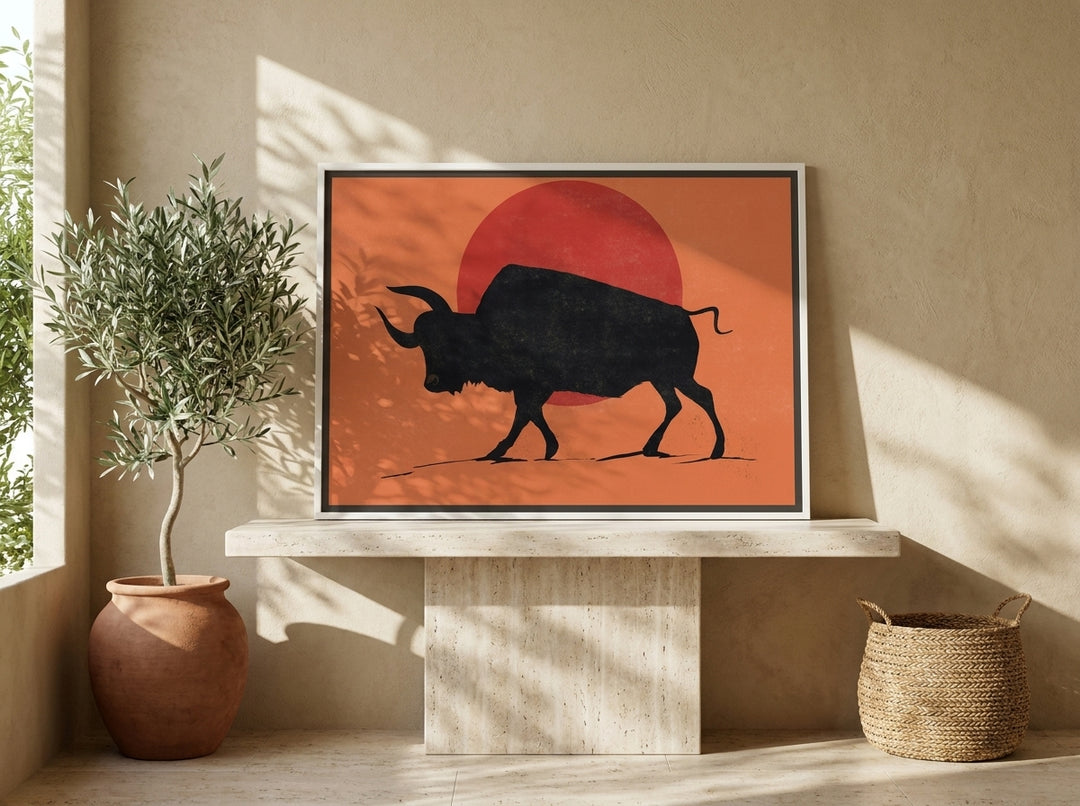 Canvas wall art with a white surround standing on a console in a Mediterranean home office