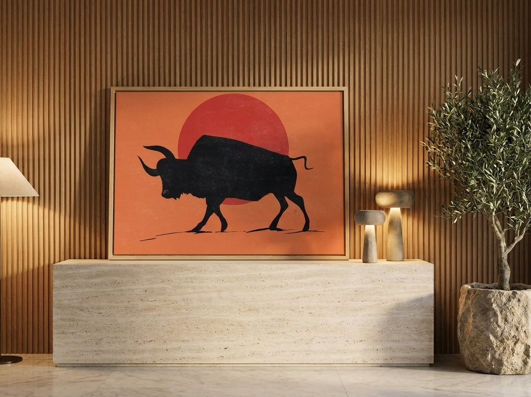Canvas wall art with a natural timber surround standing on a console in a luxe bedroom