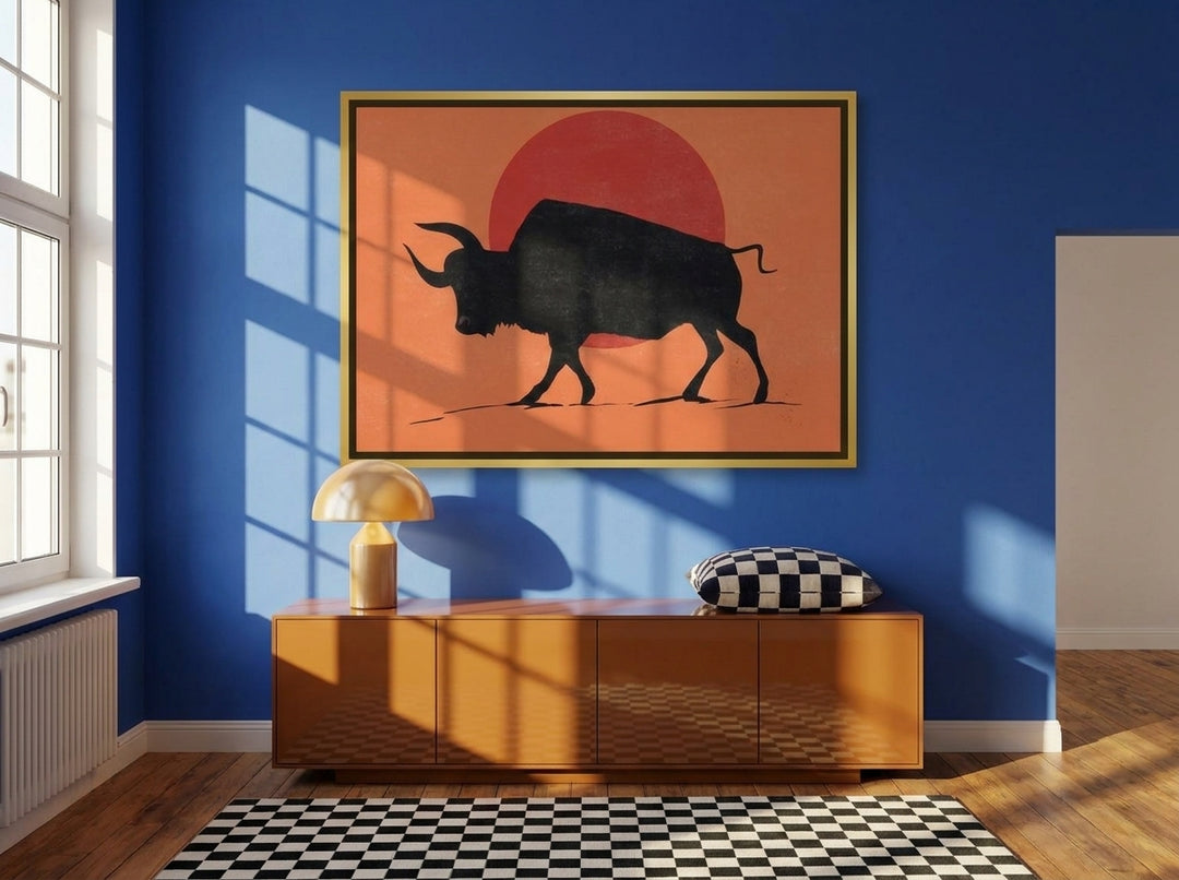 Oversized statement canvas wall art with a gold leaf surround styled on the wall in a colourful eclectic living room