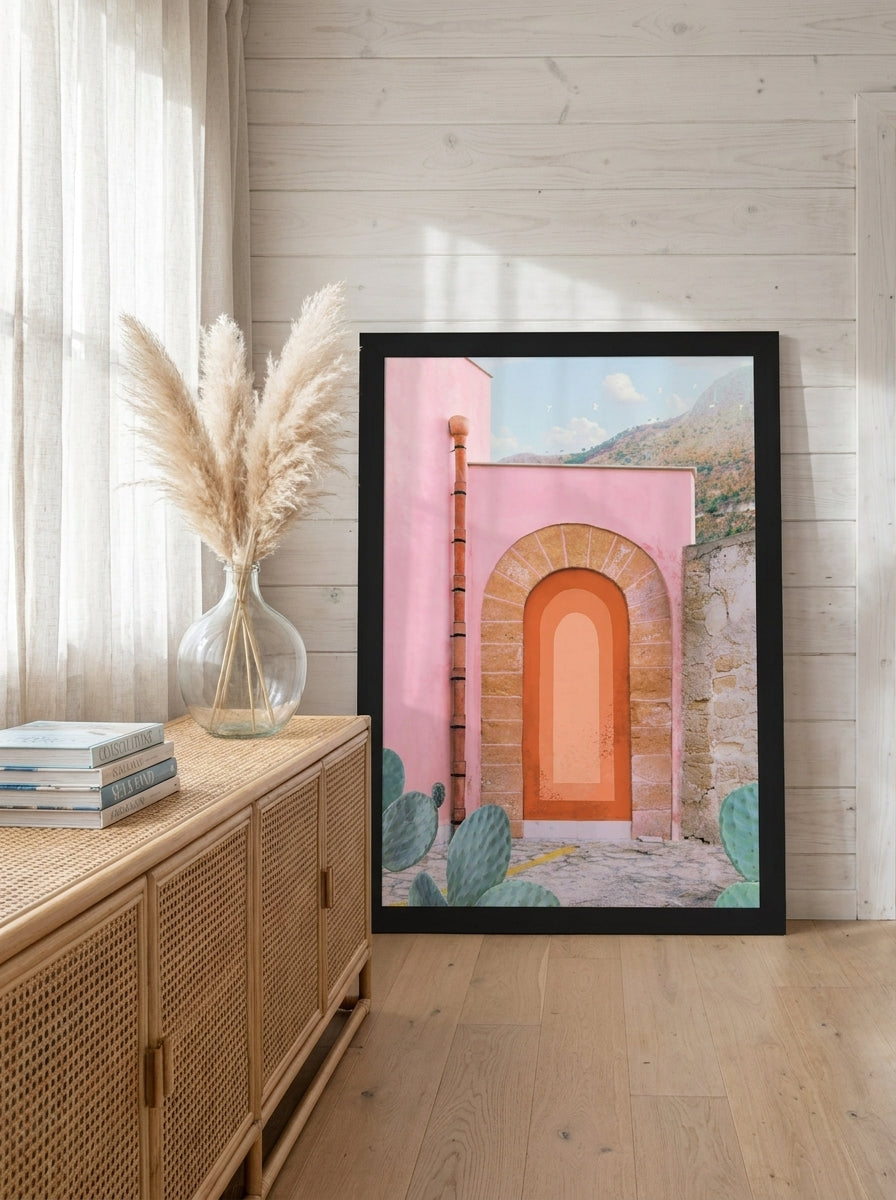 Modern wall art print standing on a sideboard in a coastal bedroom