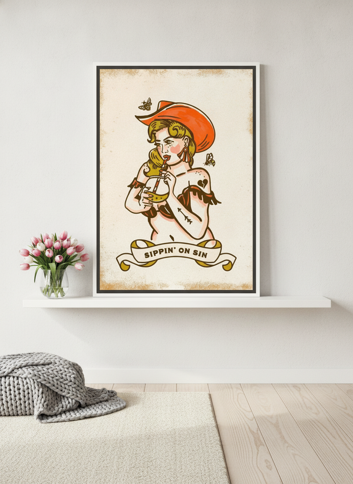 Canvas wall art with a white surround standing on a shelf in a bright Scandinavian home office