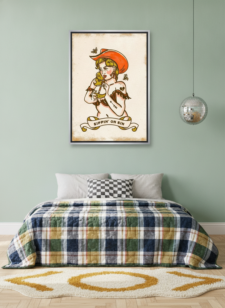 Canvas wall art with a silver leaf surround styled on the wall in a colourful eclectic bedroom