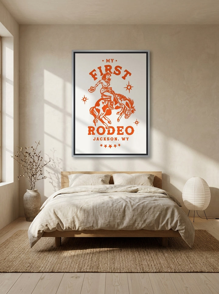 Canvas wall art with a silver leaf surround styled on the wall in a warm Japandi bedroom