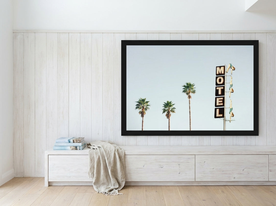Oversized statement modern wall art print styled on the wall in a coastal living room