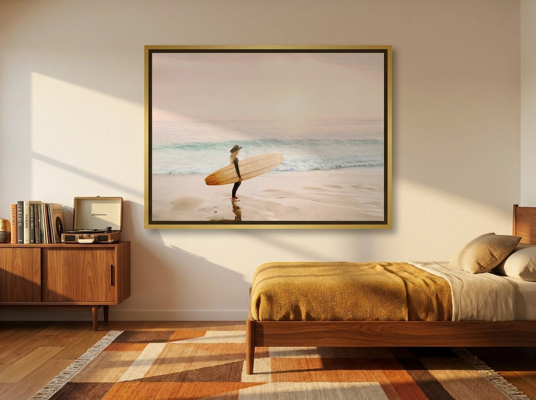 Canvas wall art with a gold leaf surround styled on the wall in a mid-century bedroom