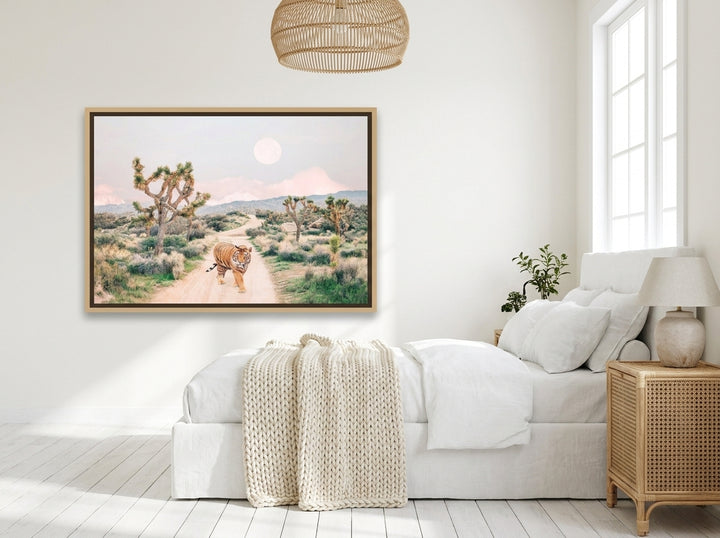 Canvas wall art with a natural timber surround styled on the wall in a bright Scandinavian bedroom