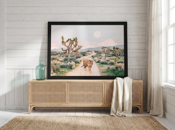Modern wall art print standing on a sideboard in a coastal home office