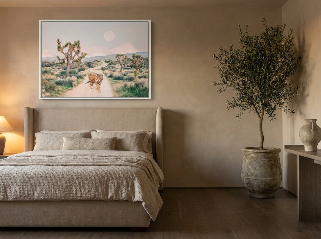 Canvas wall art with a white surround styled on the wall in a luxe bedroom