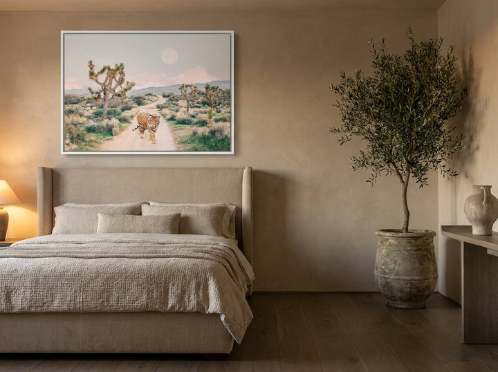 Canvas wall art with a white surround styled on the wall in a luxe bedroom