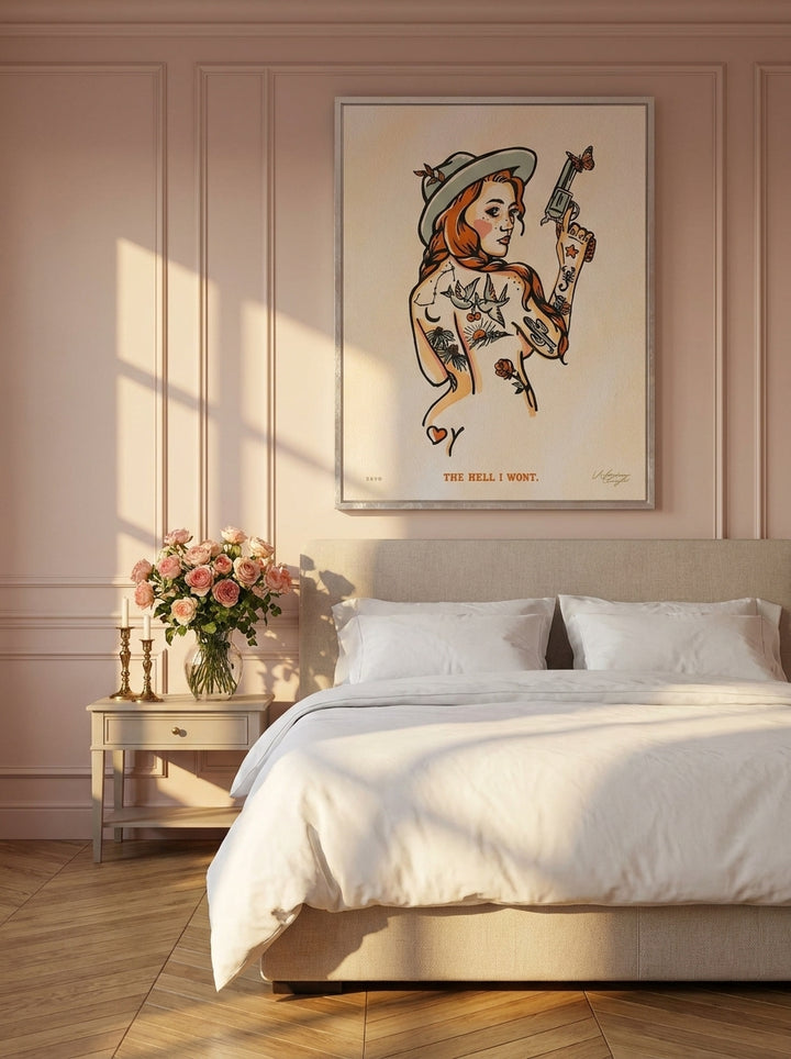 Canvas wall art with a silver leaf surround styled on the wall in a Parisian bedroom