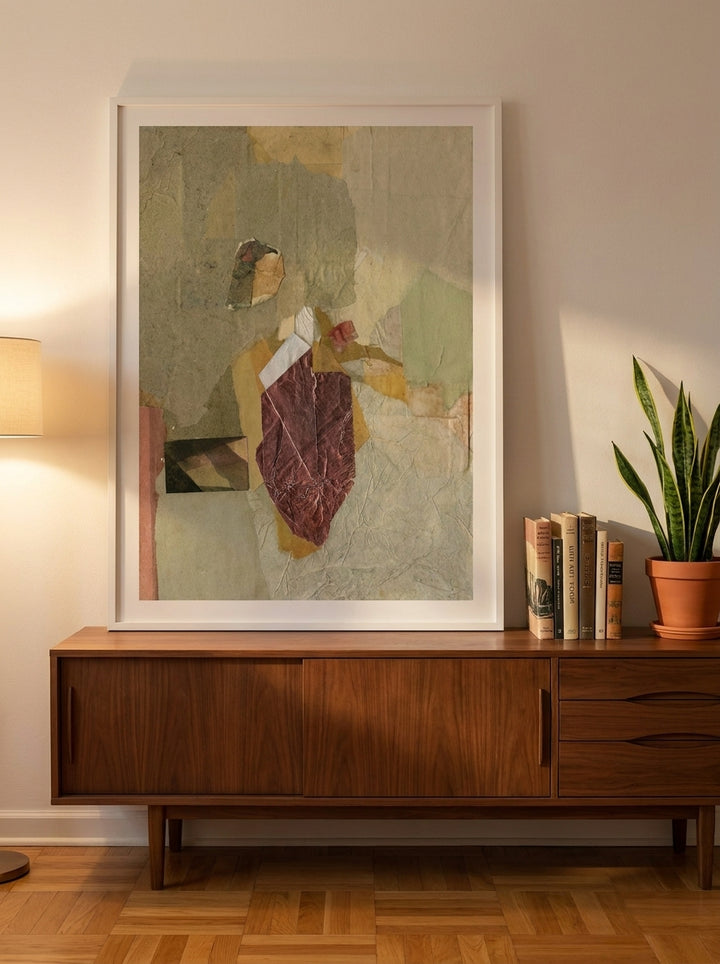 Modern wall art print standing on a sideboard in a mid-century bedroom