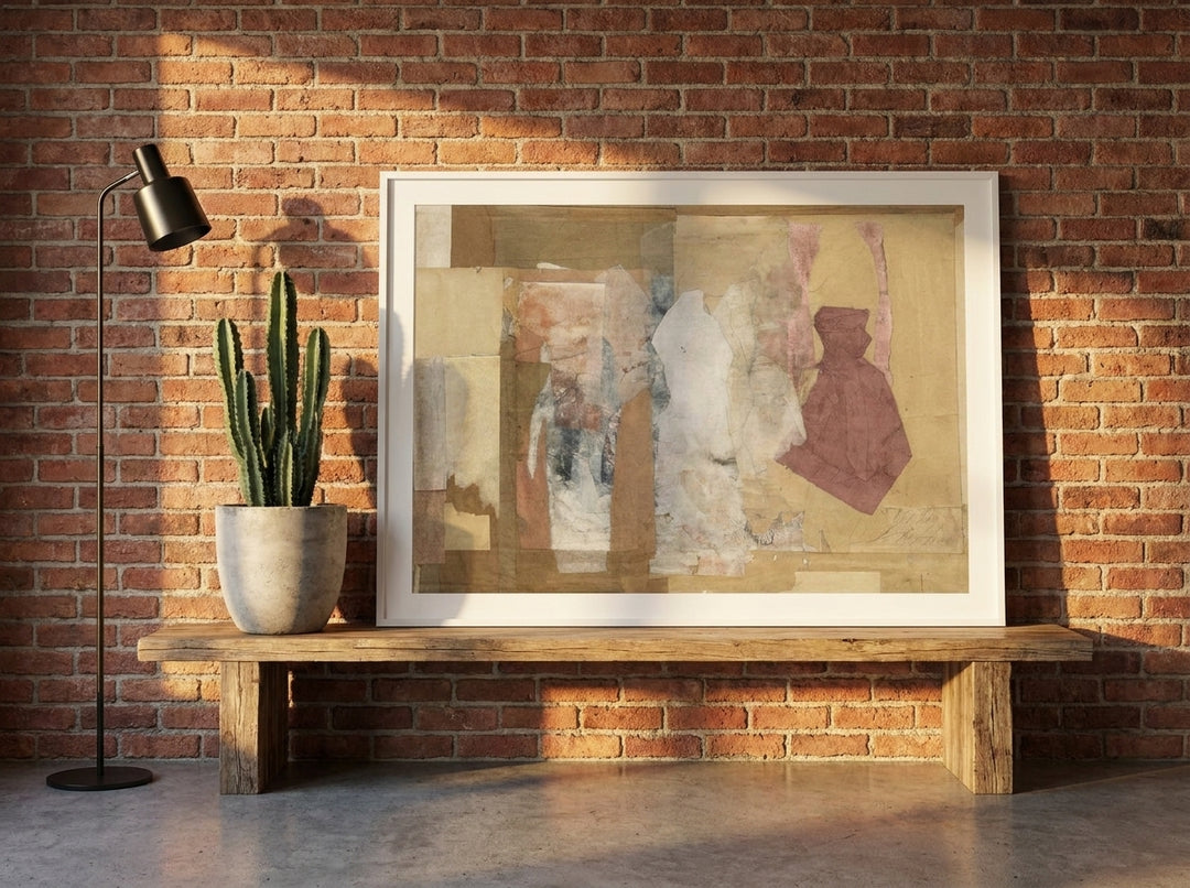 Modern wall art print standing on a bench in an industrial loft bedroom