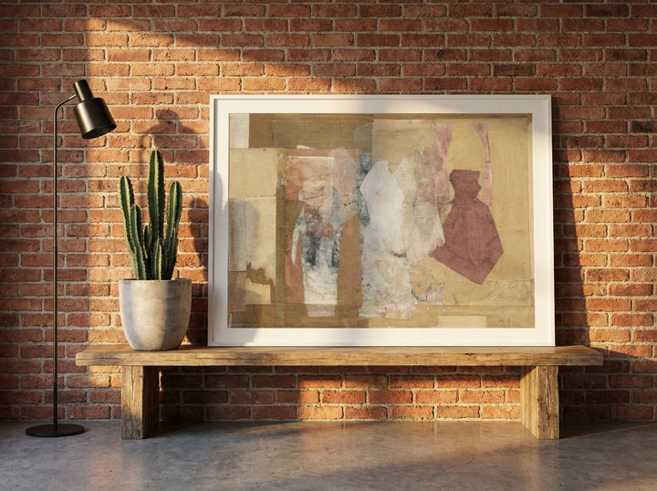Modern wall art print standing on a bench in an industrial loft bedroom