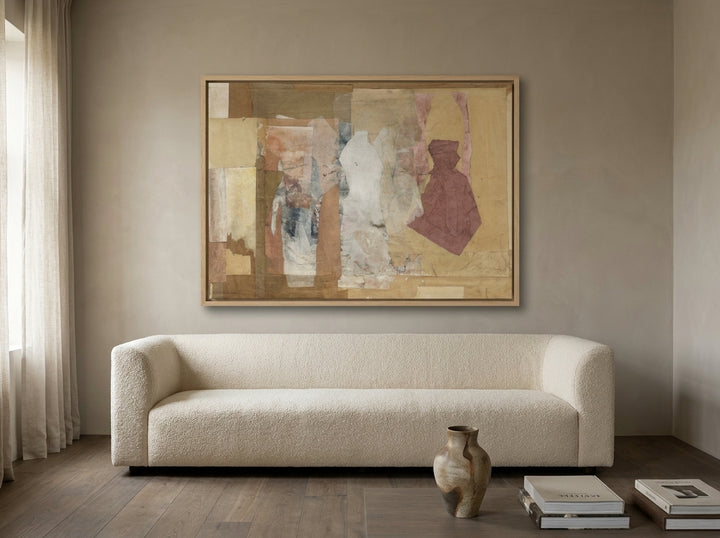 Oversized statement canvas wall art with a natural timber surround styled on the wall in a luxe living room