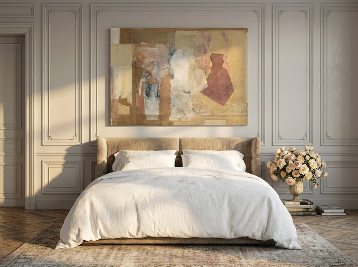 Stretched canvas wall art styled on the wall in a Parisian bedroom
