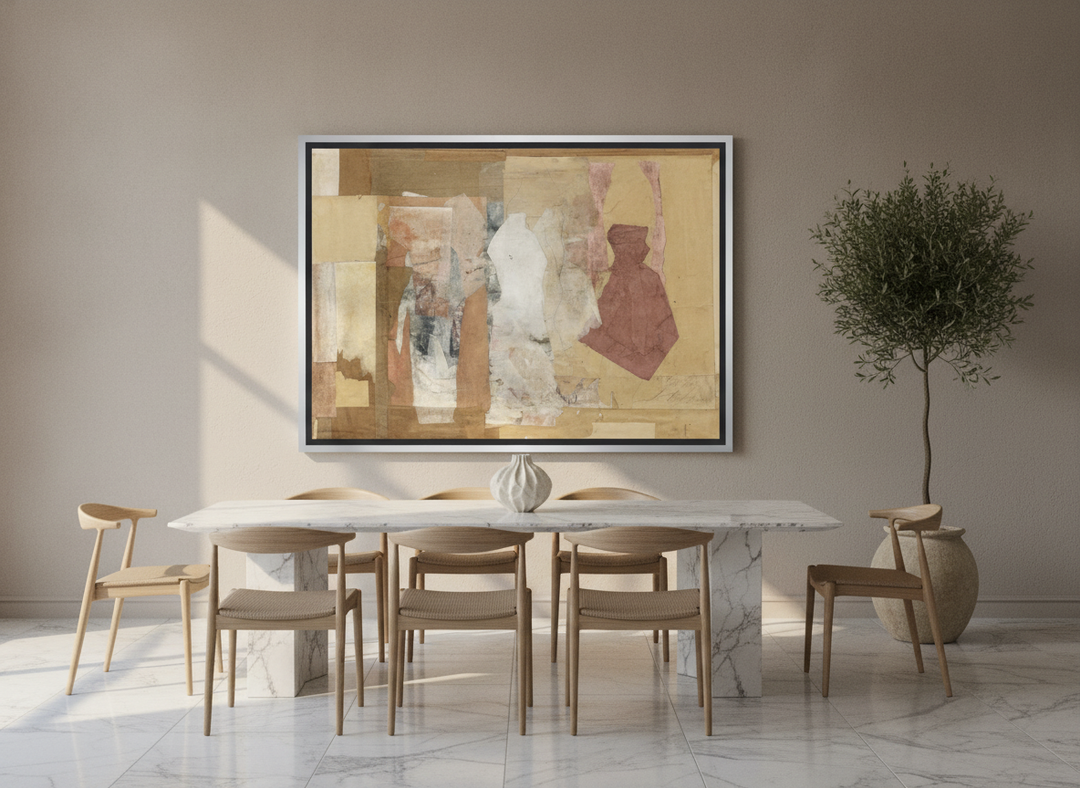 Oversized statement canvas wall art with a silver leaf surround styled on the wall in a luxe dining room