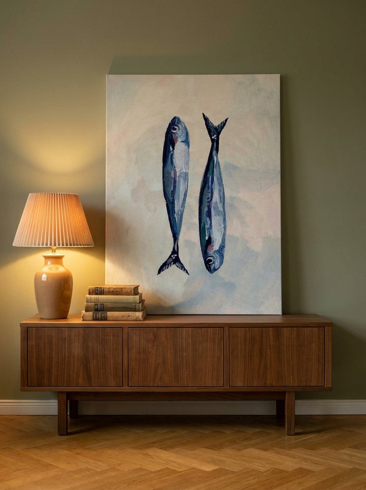 Stretched canvas wall art standing on a sideboard in a mid-century living room