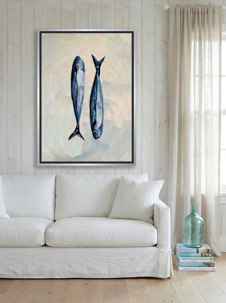 Canvas wall art with a silver leaf surround styled on the wall in a coastal living room