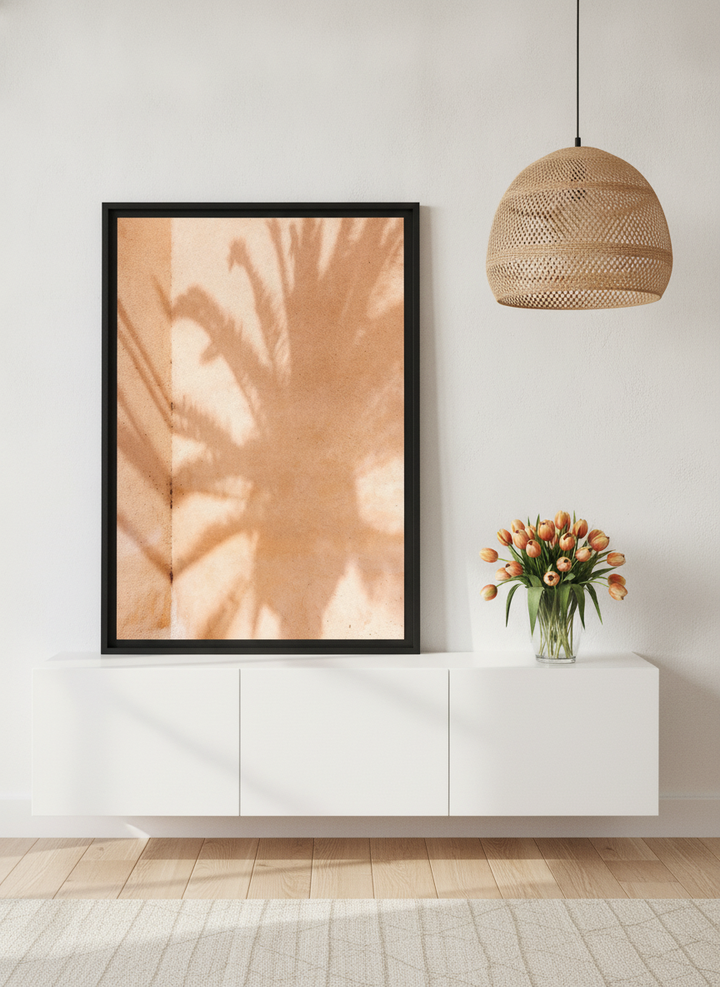 Modern wall art print standing on a sideboard in a bright Scandinavian home office