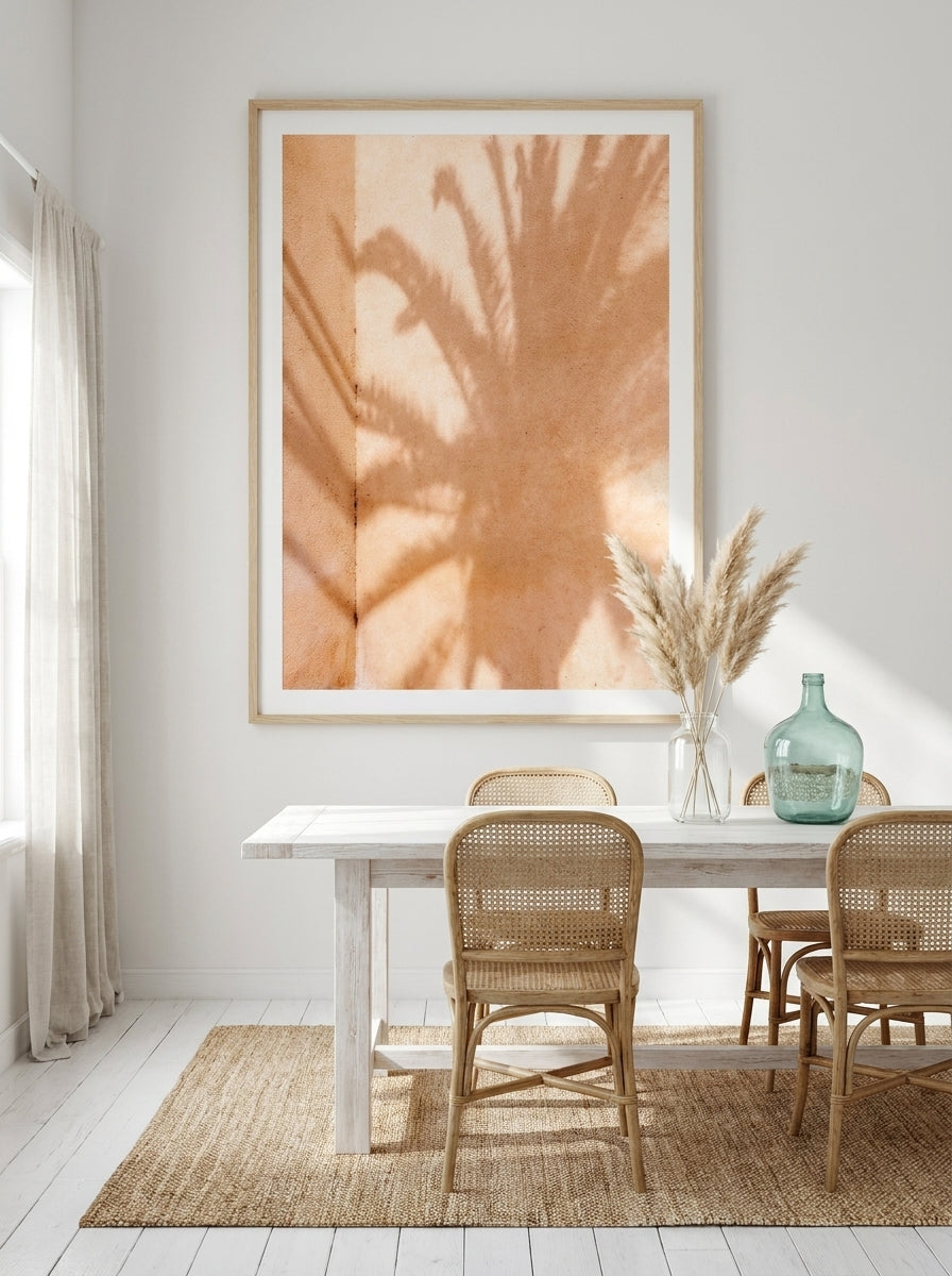 Oversized statement modern wall art print styled on the wall in a coastal dining room