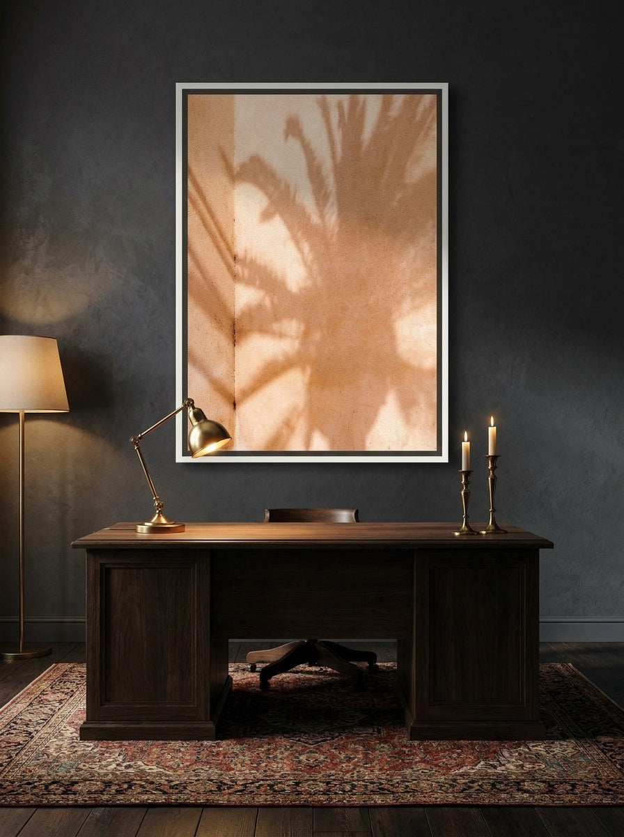 Canvas wall art with a white surround styled on the wall in a moody home office