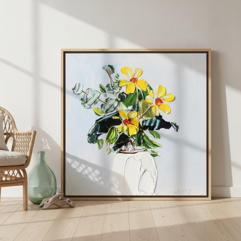 Oversized statement canvas wall art with a natural timber surround leaning against the wall in a coastal dining room