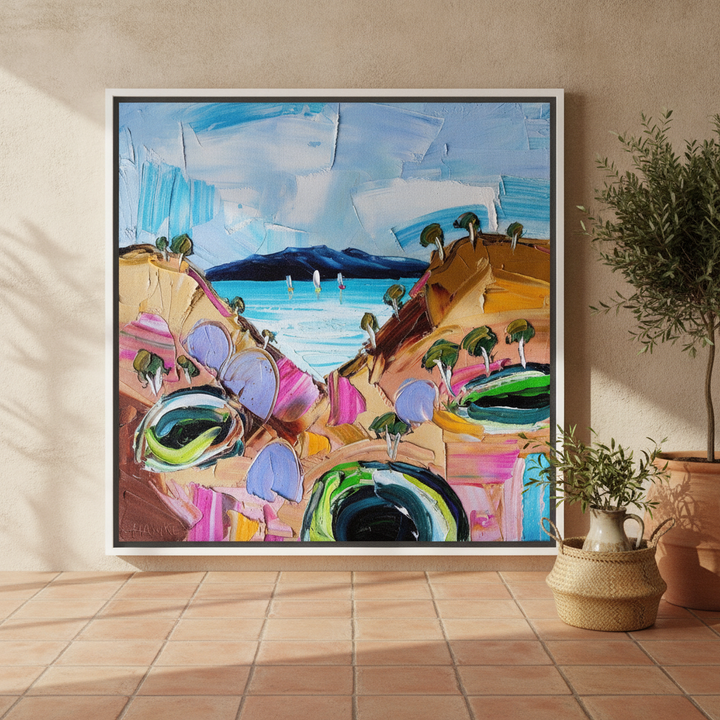 Oversized statement canvas wall art with a white surround leaning against the wall in a Mediterranean dining room
