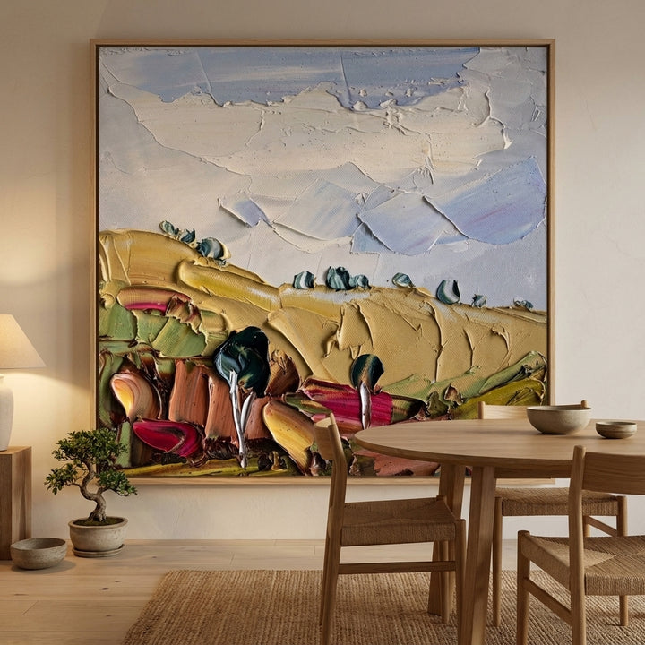 Oversized statement canvas wall art with a natural timber surround styled on the wall in a warm Japandi dining room