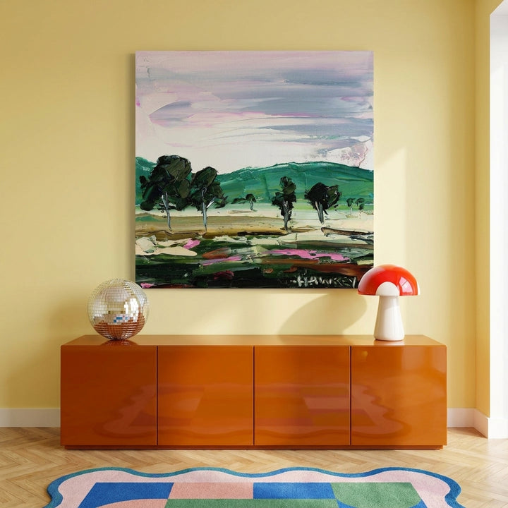 Stretched canvas wall art styled on the wall in a colourful eclectic living room