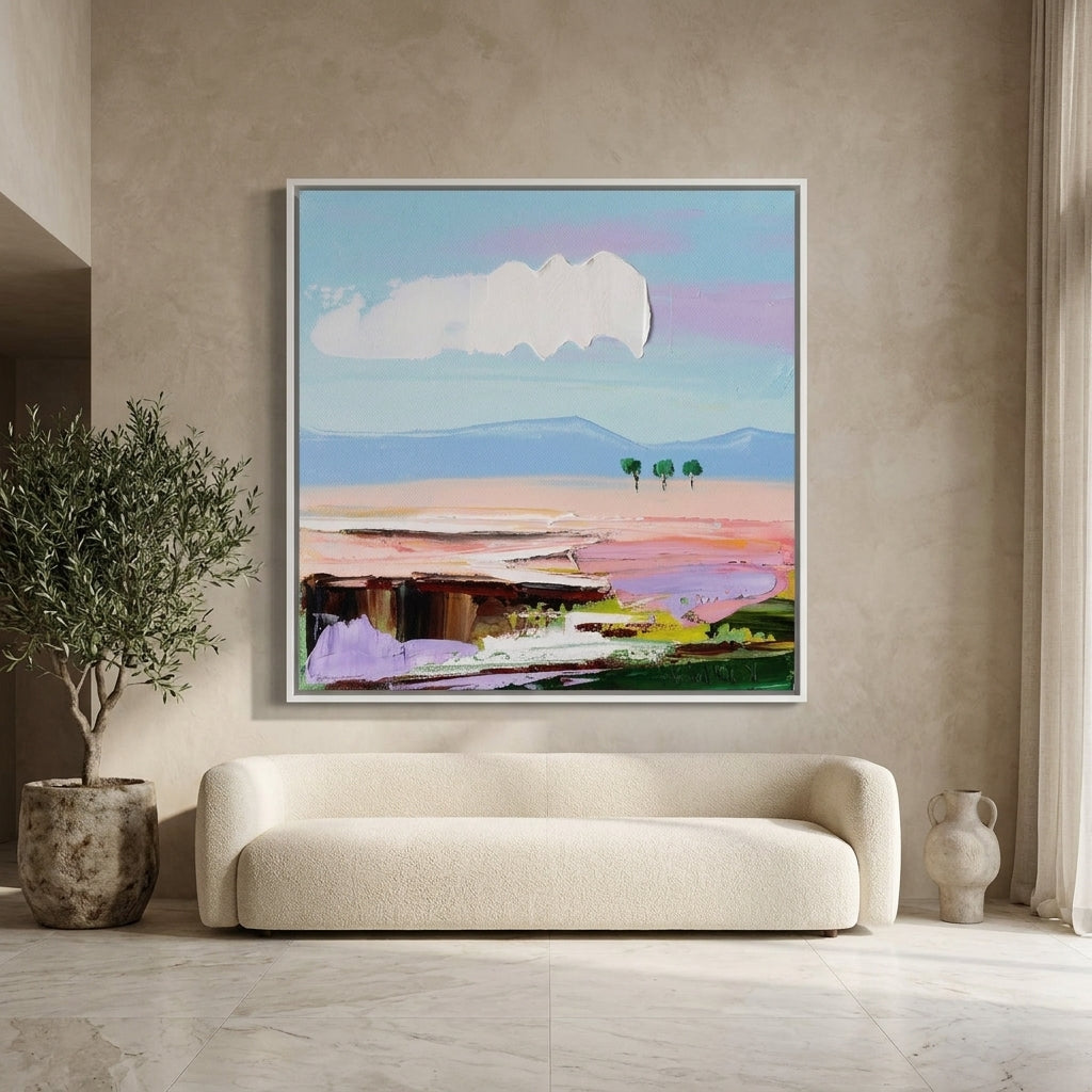 Oversized statement canvas wall art with a white surround styled on the wall in a luxe living room