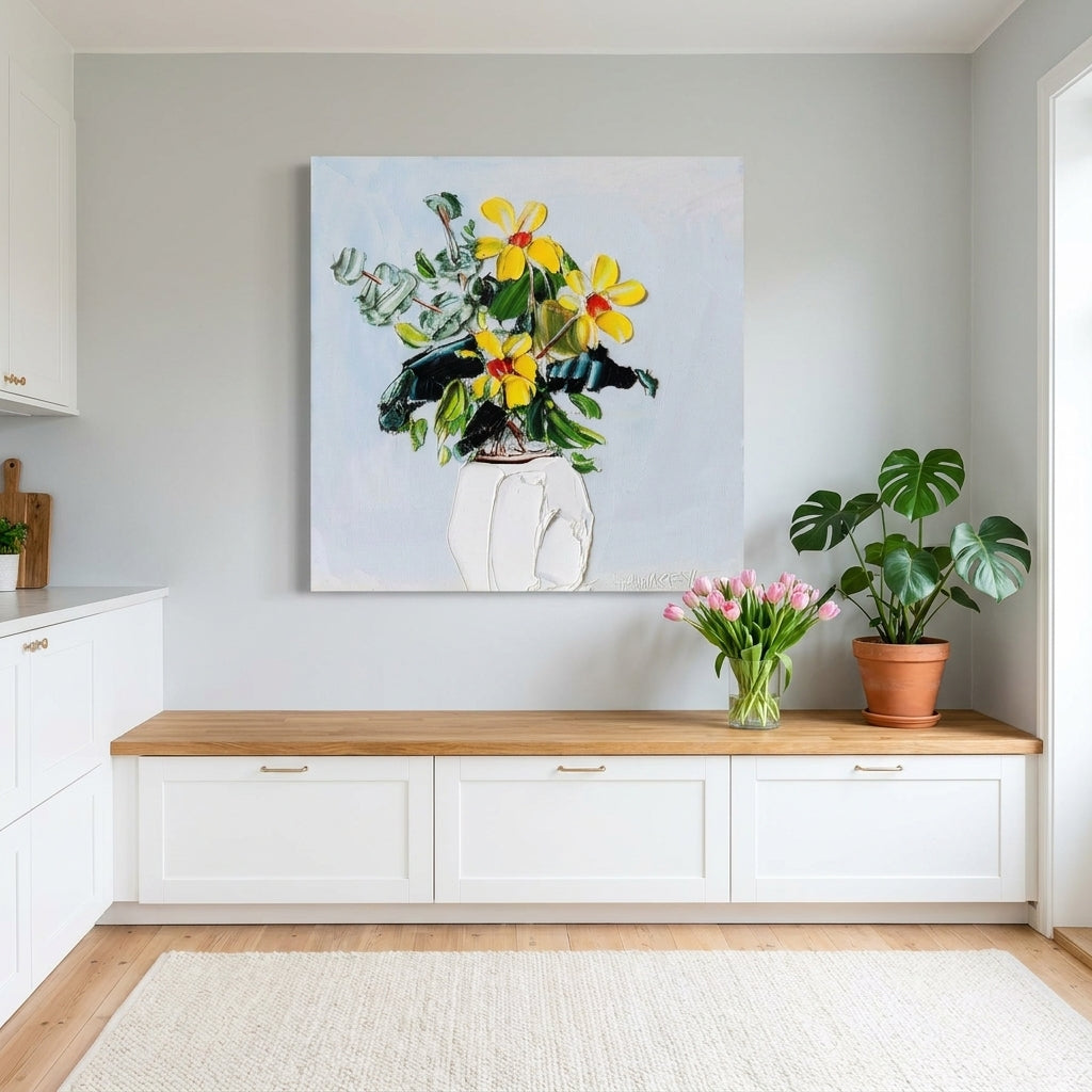 Stretched canvas wall art styled on the wall in a bright Scandinavian kitchen