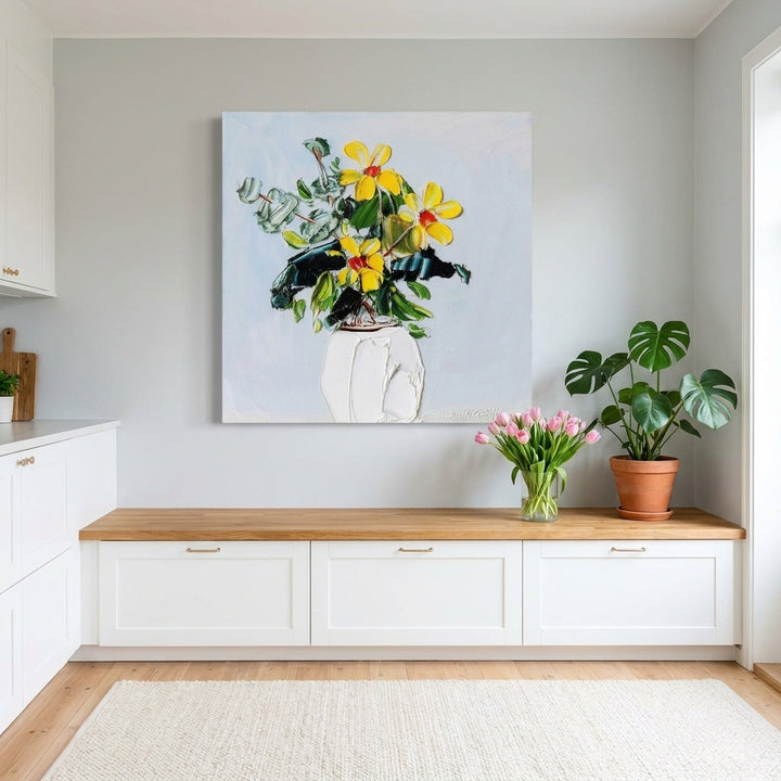 Stretched canvas wall art styled on the wall in a bright Scandinavian kitchen