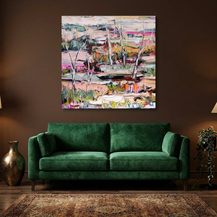 Stretched canvas wall art styled on the wall in a moody living room