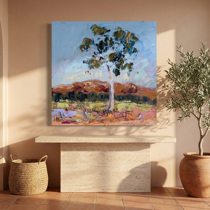 Stretched canvas wall art styled on the wall in a Mediterranean living room