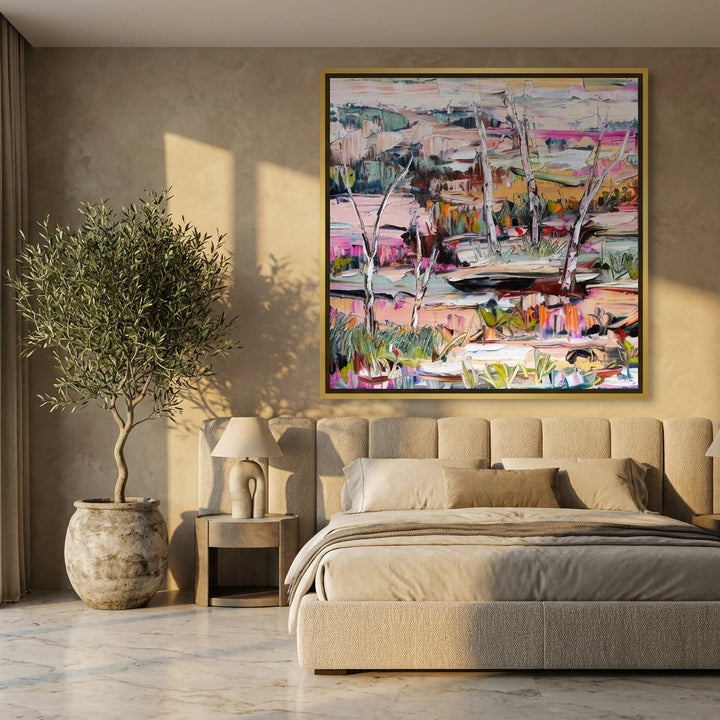Oversized statement canvas wall art with a gold leaf surround styled on the wall in a luxe bedroom