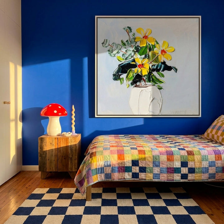 Oversized statement canvas wall art with a white surround styled on the wall in a colourful eclectic bedroom