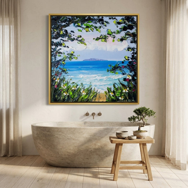 Canvas wall art with a gold leaf surround styled on the wall in a warm Japandi bathroom