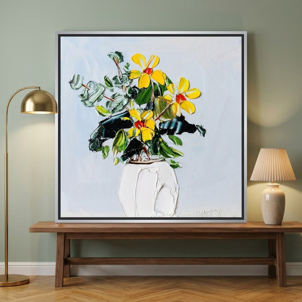 Canvas wall art with a silver leaf surround standing on a kitchen bench in a mid-century kitchen