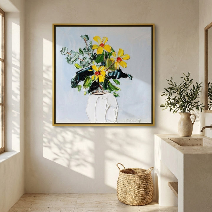 Canvas wall art with a gold leaf surround styled on the wall in a Mediterranean bathroom