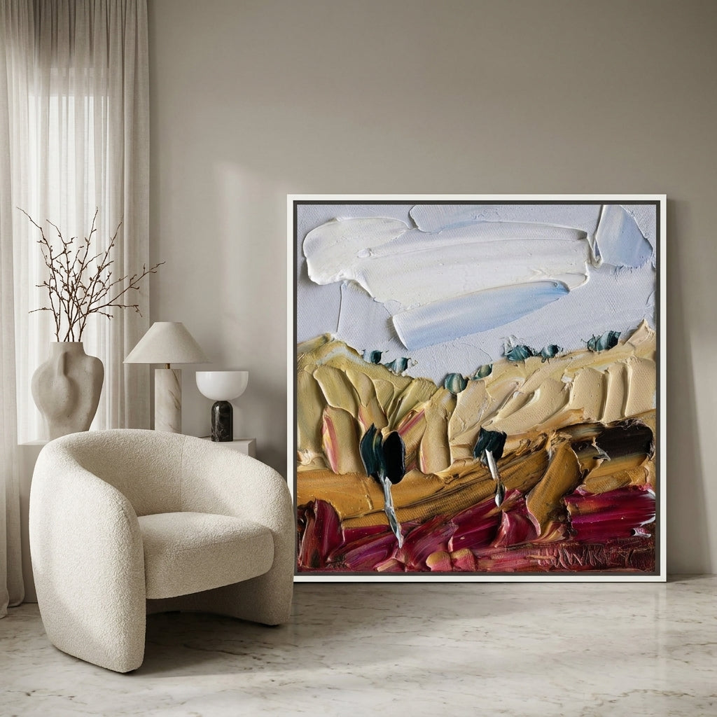 Oversized statement canvas wall art with a white surround leaning against the wall in a luxe bedroom