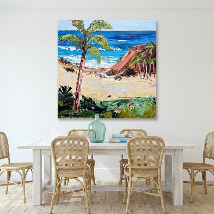 Stretched canvas wall art styled on the wall in a coastal dining room